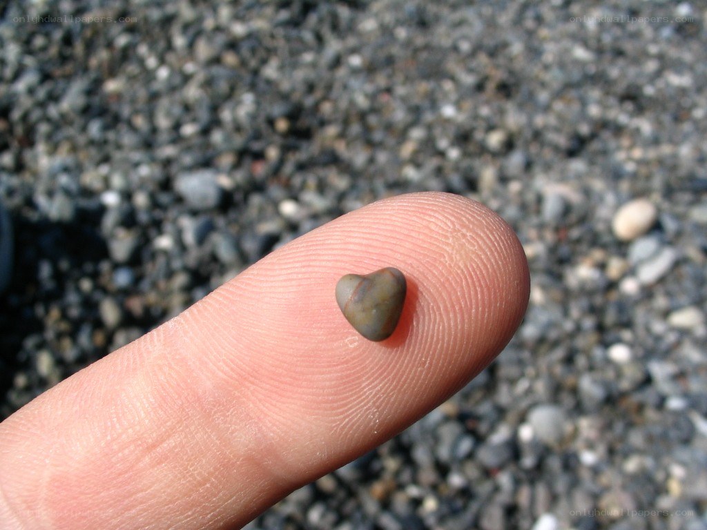 heart-shaped stone on finger