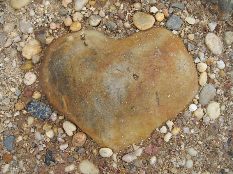 heart-shaped stone on pebble beach