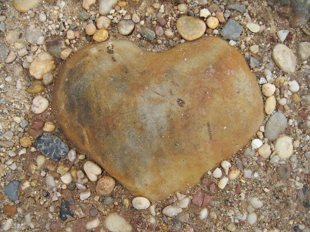 heart-shaped stone on pebble beach