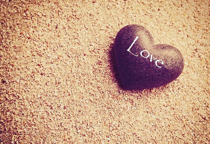 Heart-shaped Stone on Sand