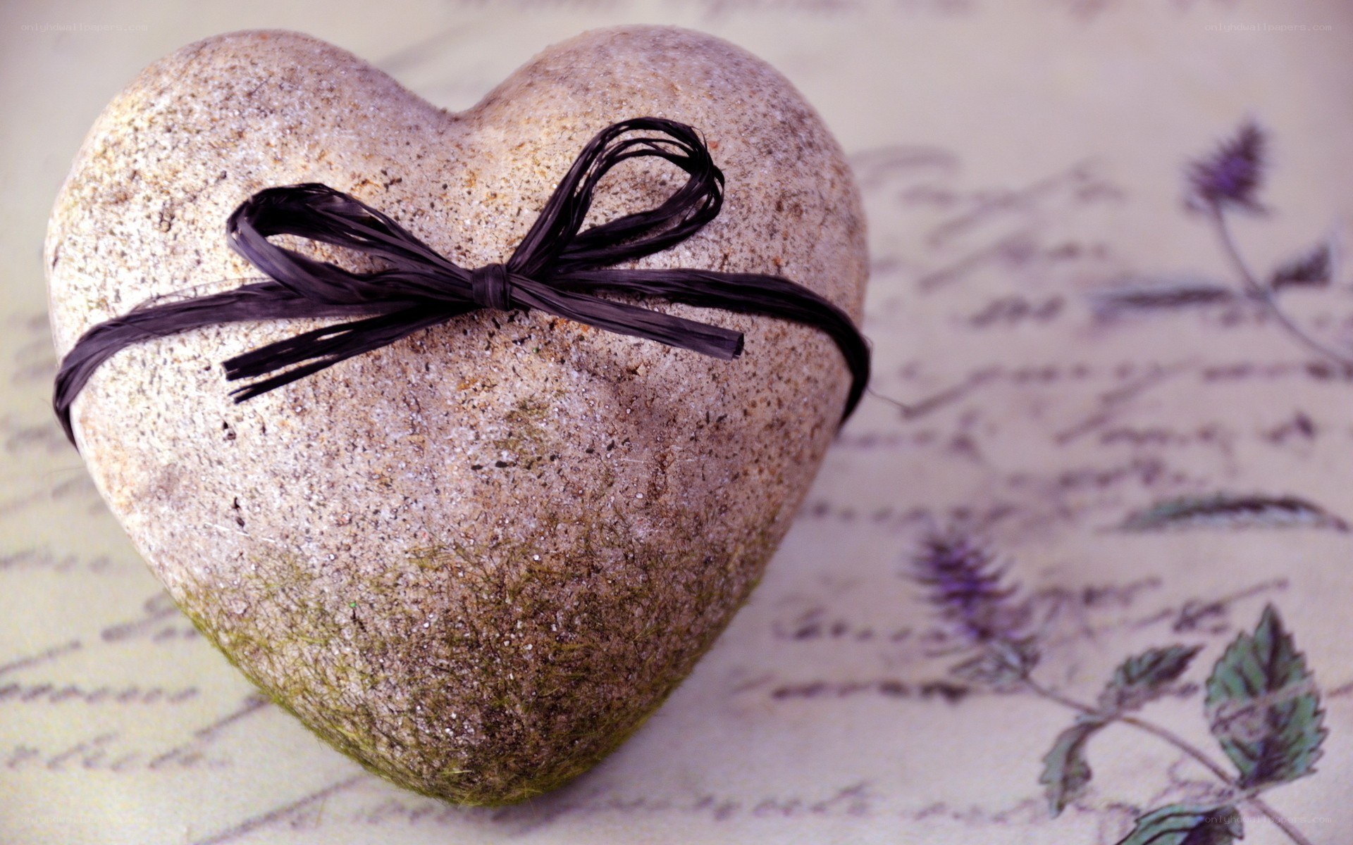 heart-shaped stone with ribbon