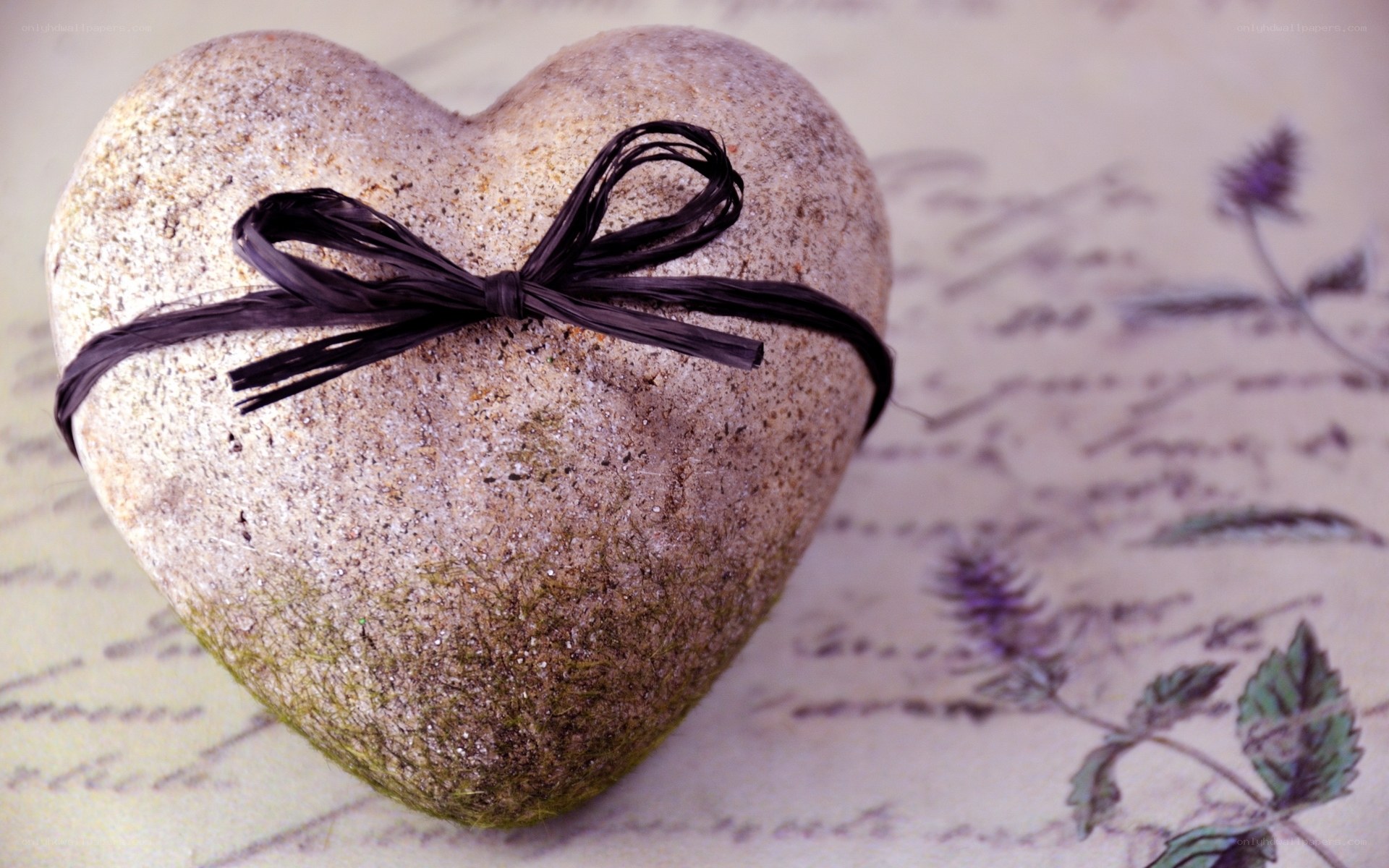 heart-shaped stone with ribbon