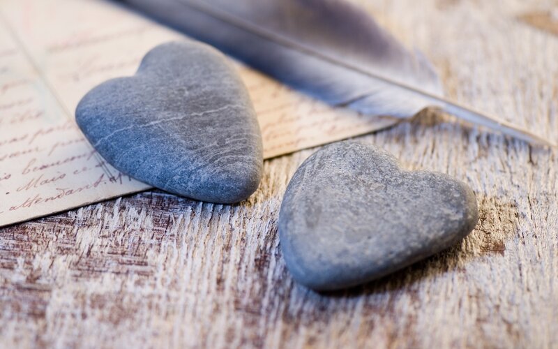 Heart-shaped stones and letter