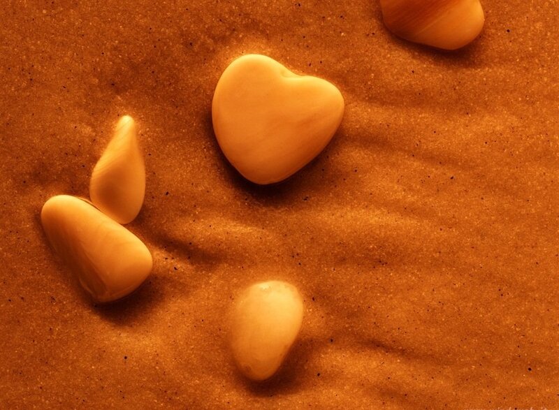 Heart-shaped Stones on Sand