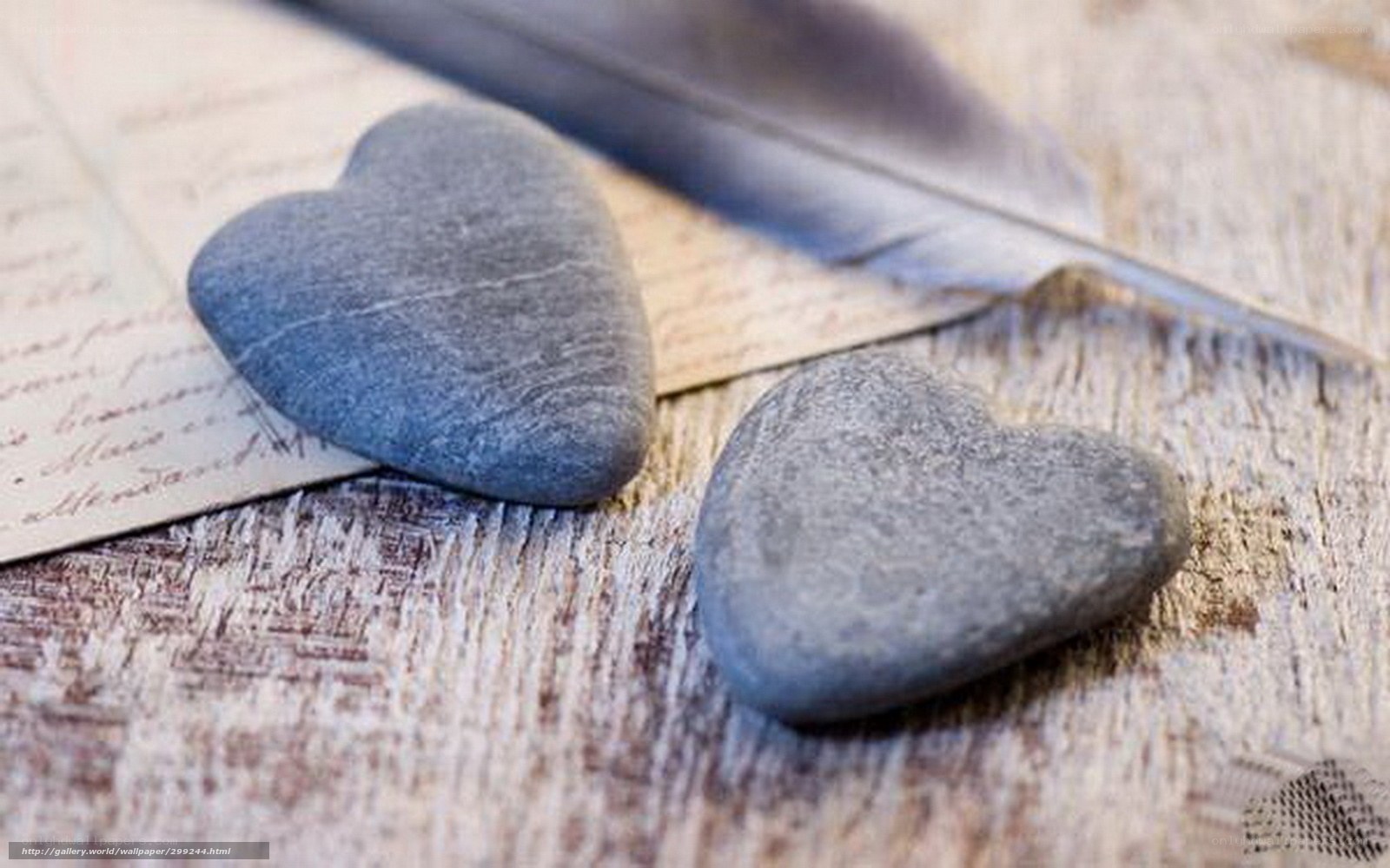 Heart-shaped stones on wood