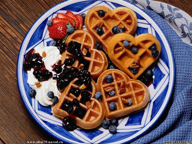 heart-shaped waffles with berries