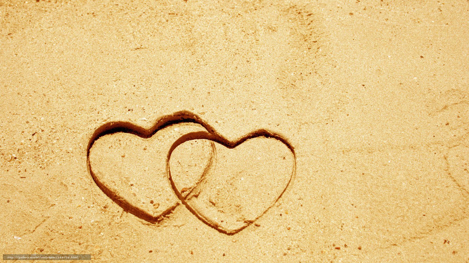 hearts drawn in sand