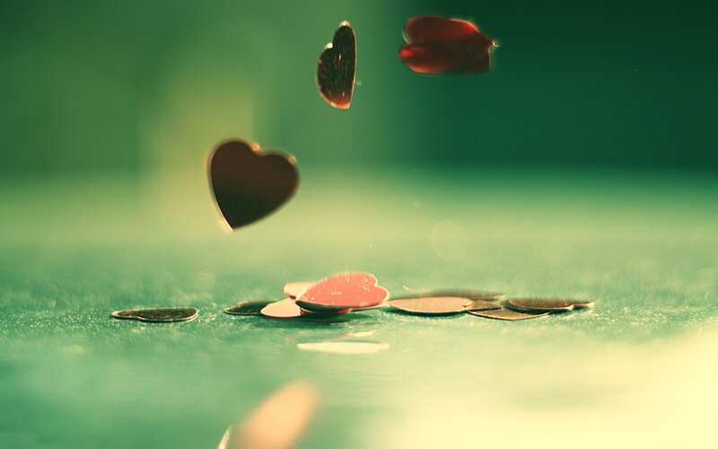 hearts falling on green surface