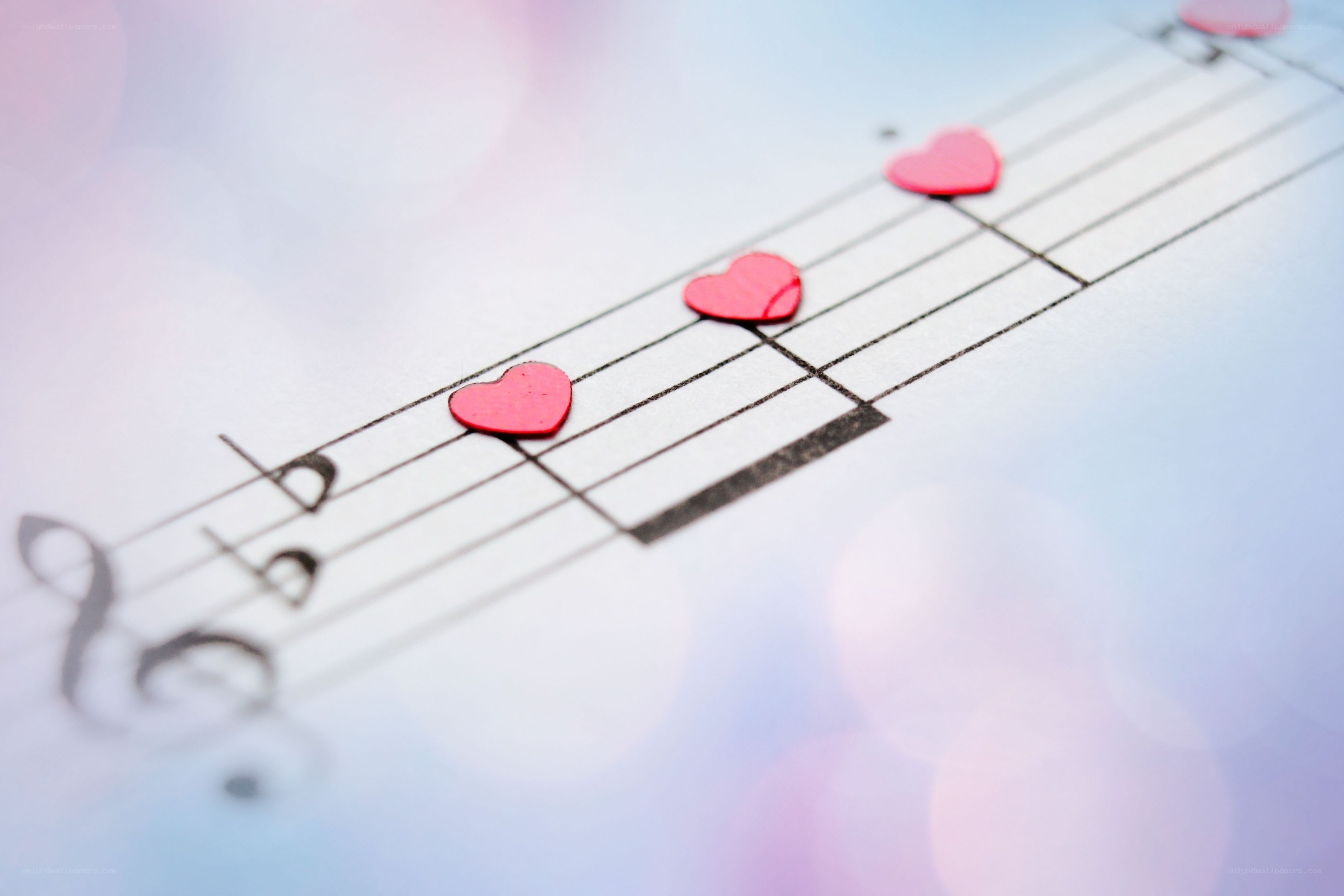 hearts on a music sheet