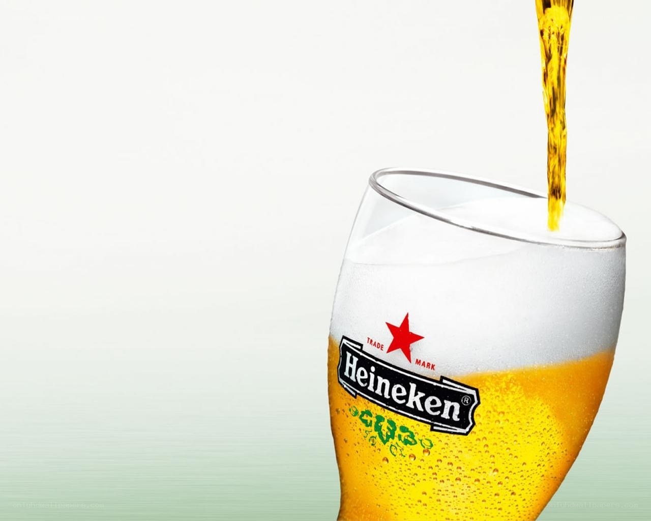 Heineken beer being poured
