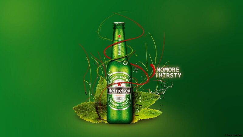 Heineken beer bottle on green