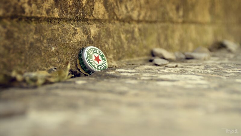 Heineken bottle cap on stone