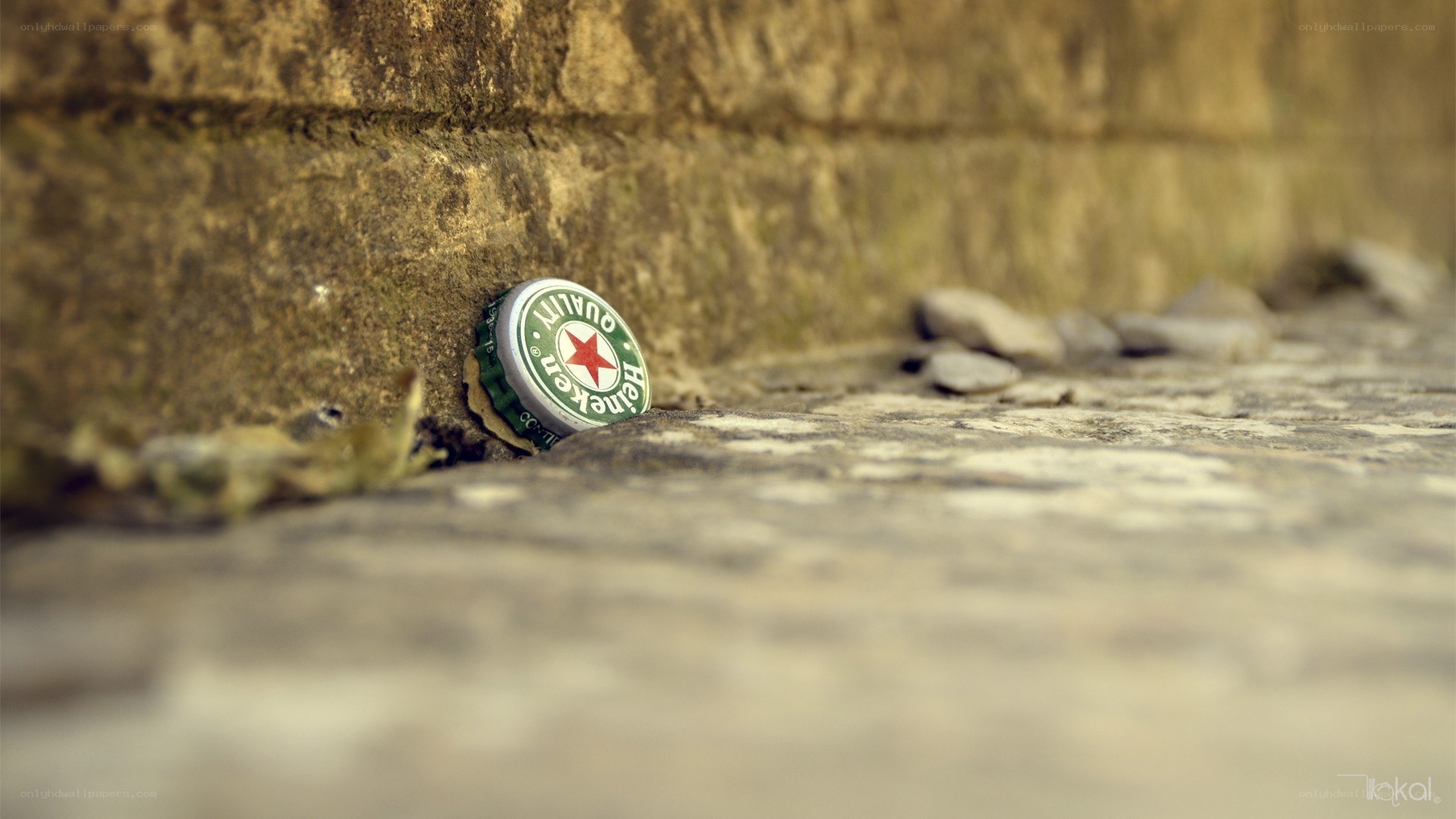 Heineken bottle cap on stone