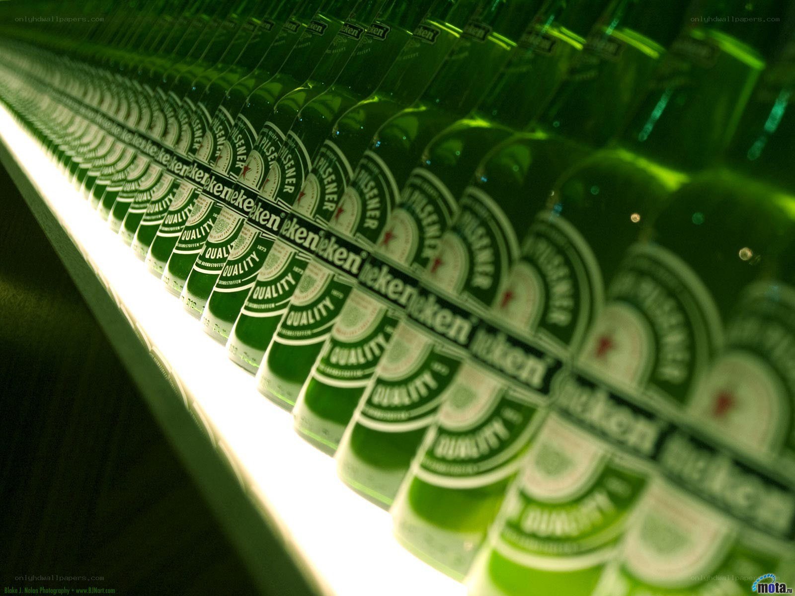 Heineken bottles in a row