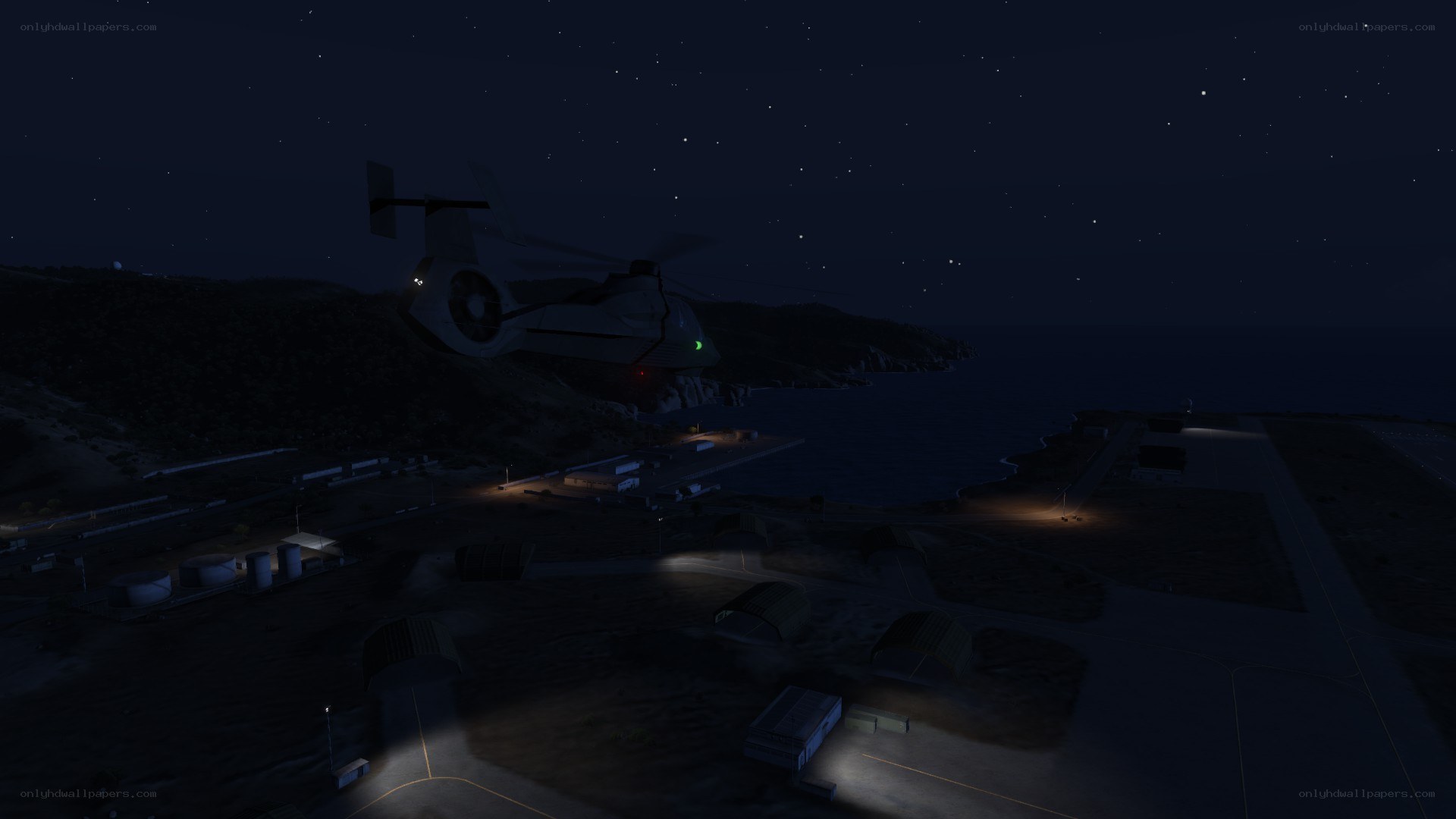 Helicopter at coastal base at night
