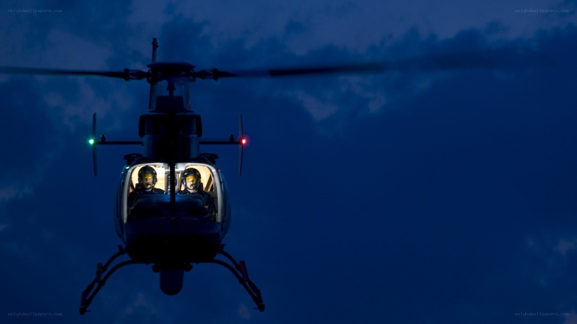 helicopter at dusk with crew