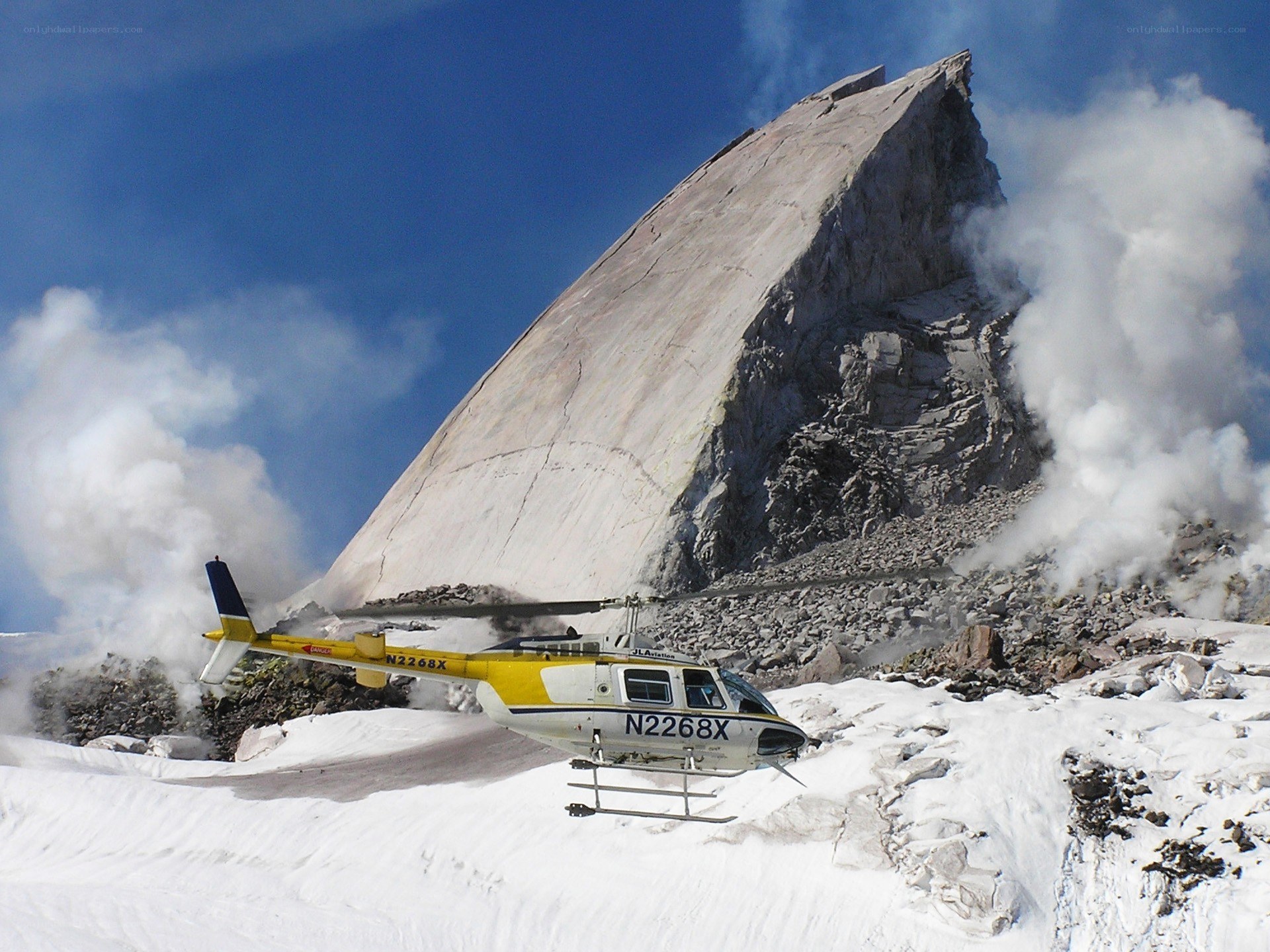 Helicopter at erupting volcano