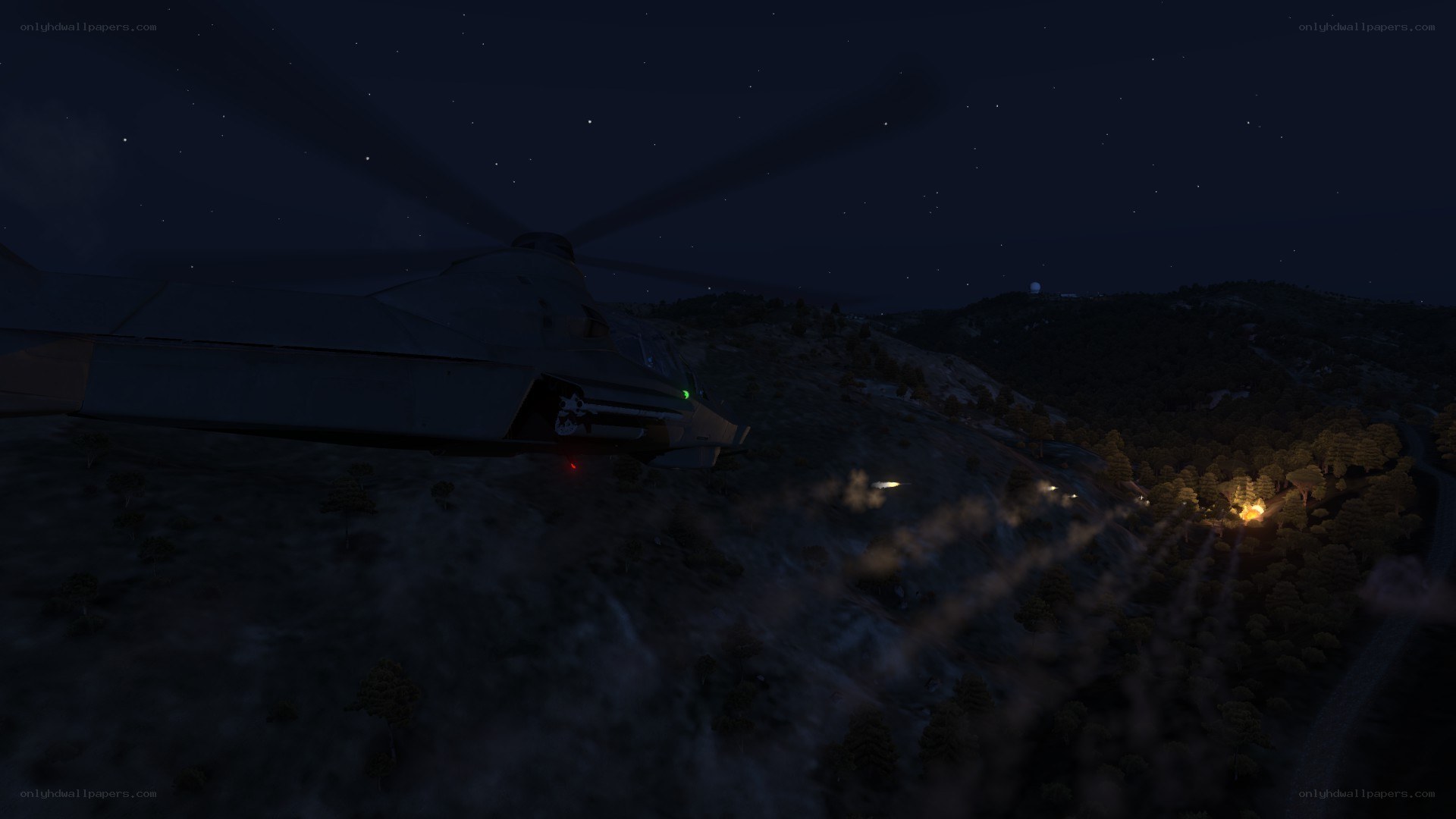 Helicopter at night over hills
