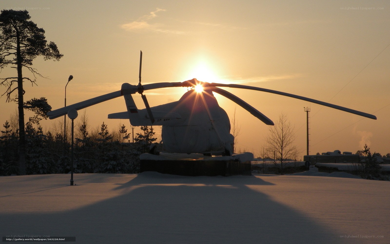Helicopter at sunset in snow