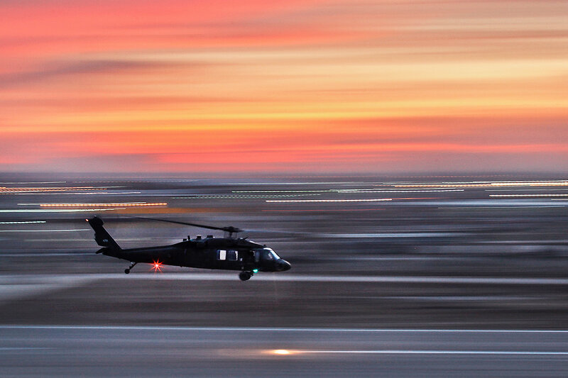Helicopter at sunset on runway