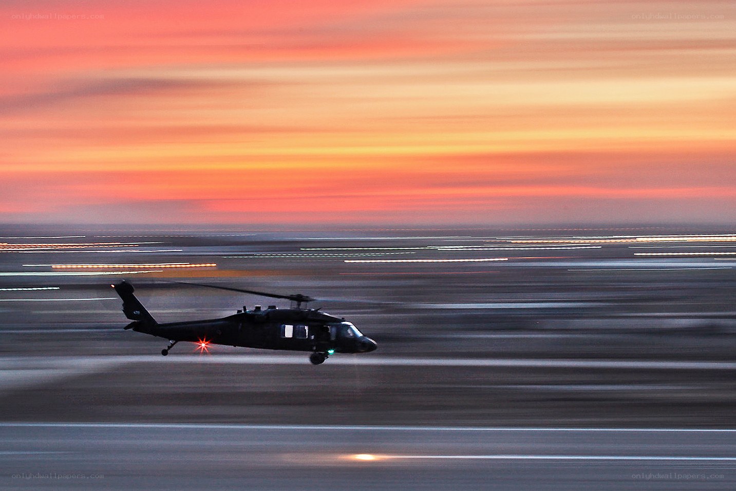 Helicopter at sunset on runway