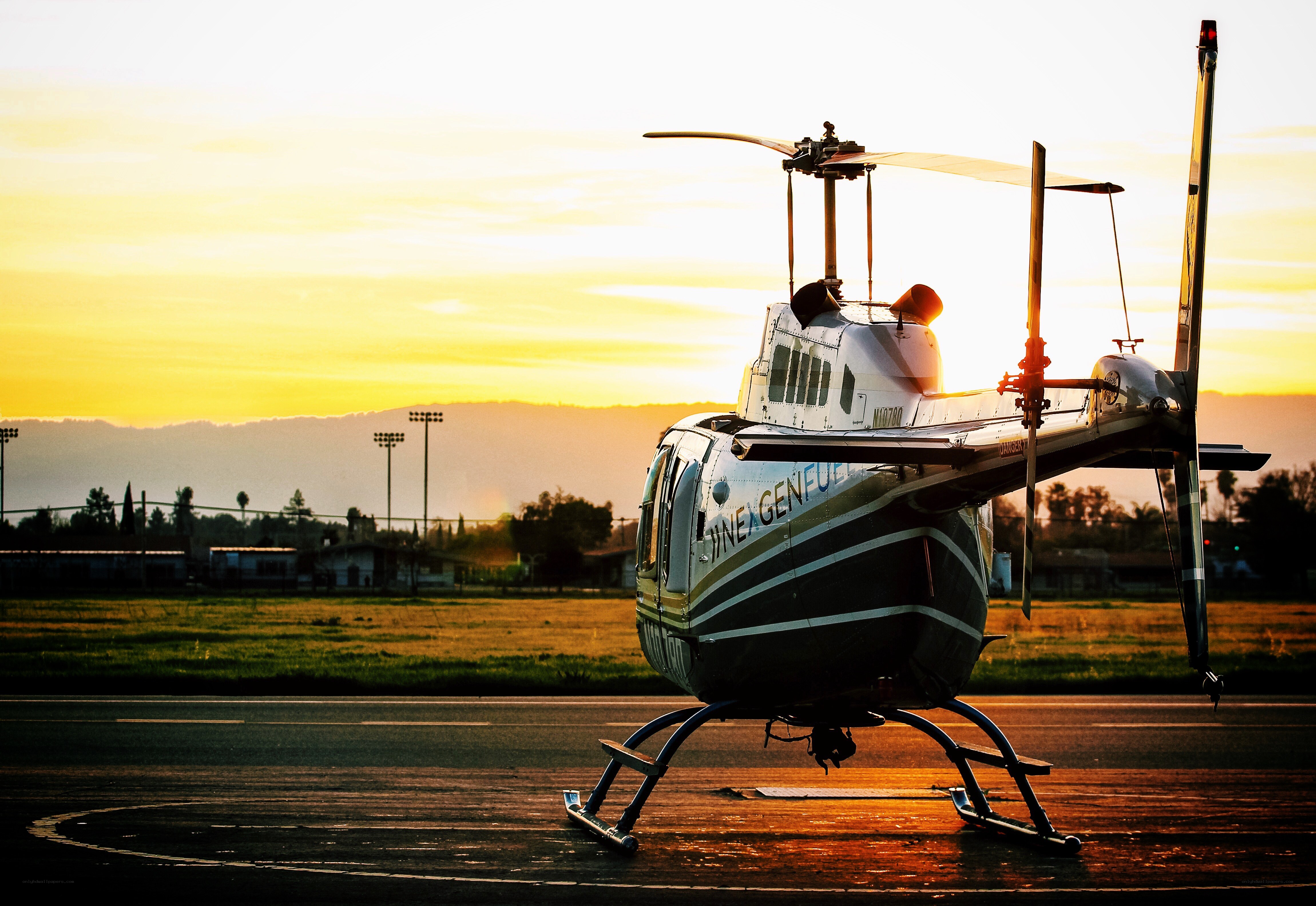 Helicopter at sunset on tarmac