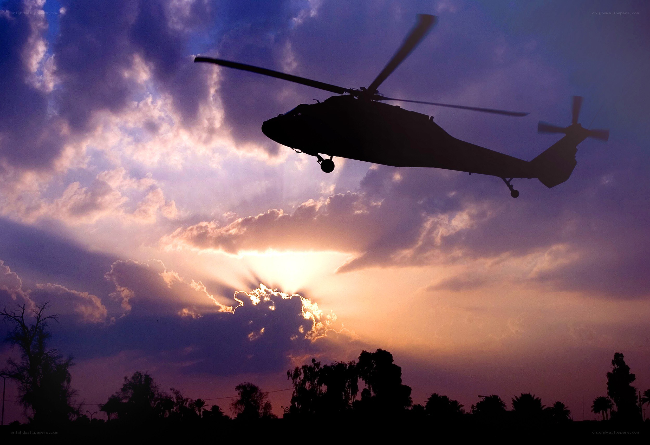 Helicopter at sunset silhouette