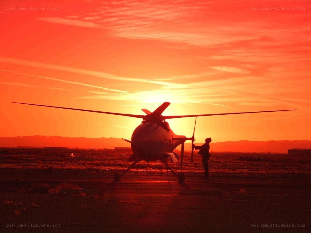 helicopter at sunset silhouette