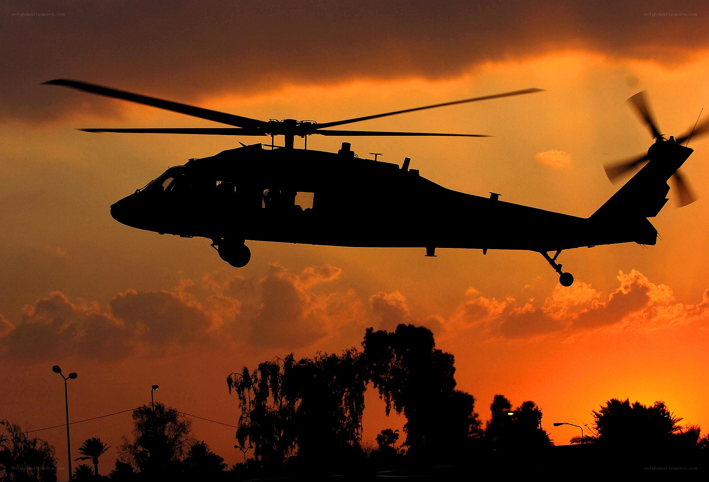 Helicopter at sunset silhouette