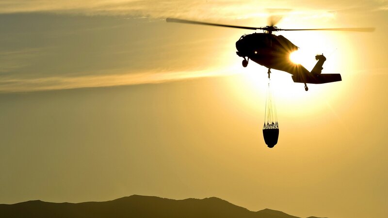 Helicopter at sunset with cargo