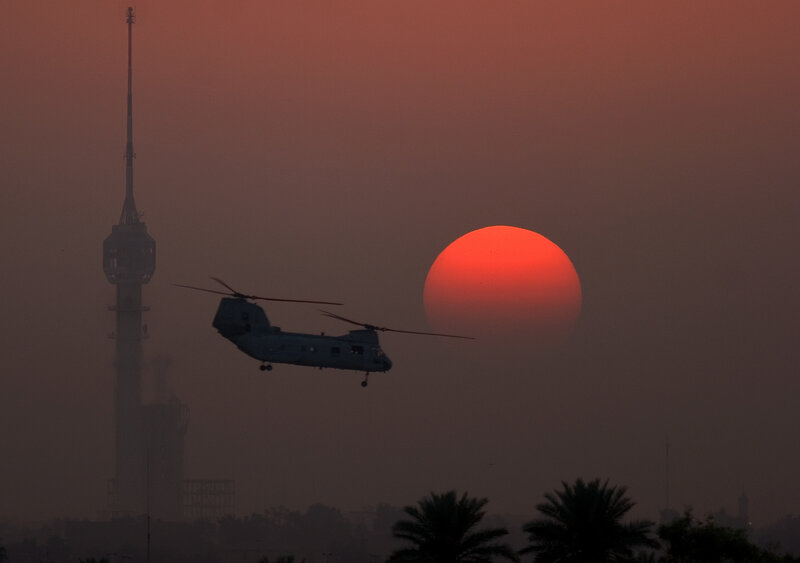 Helicopter at sunset with tower