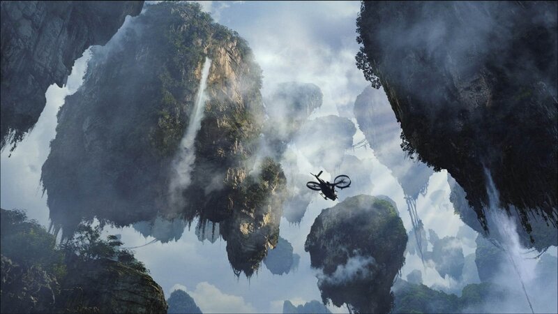 Helicopter Flying Between Mountains