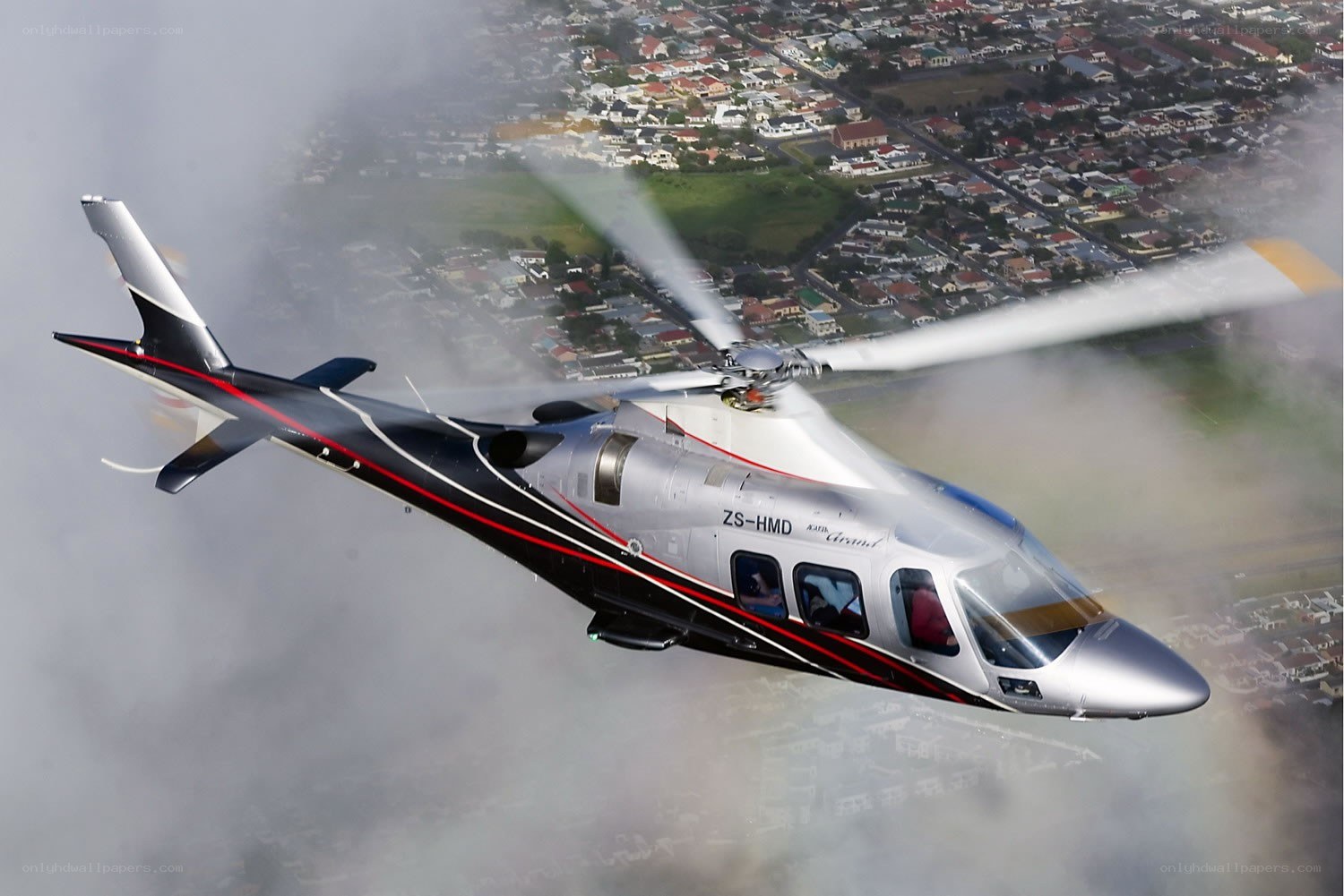 Helicopter flying over city