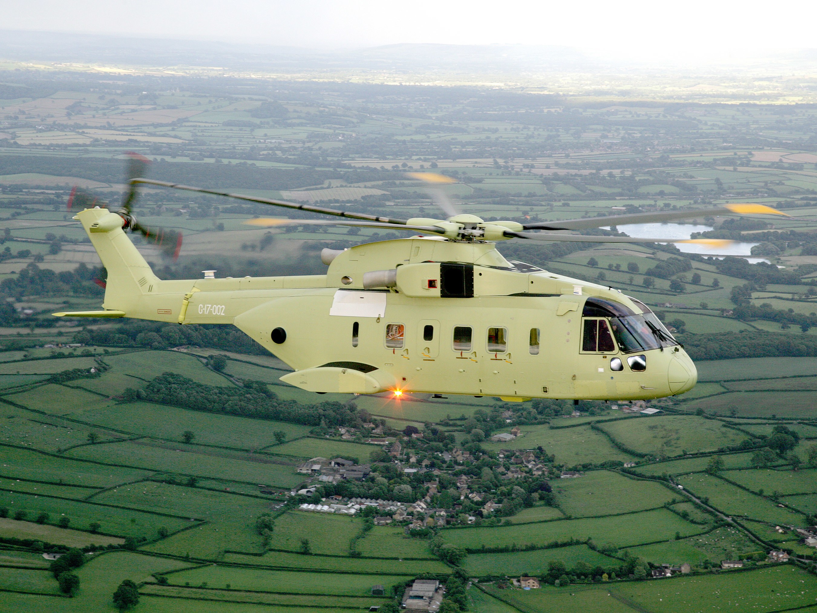 helicopter flying over countryside