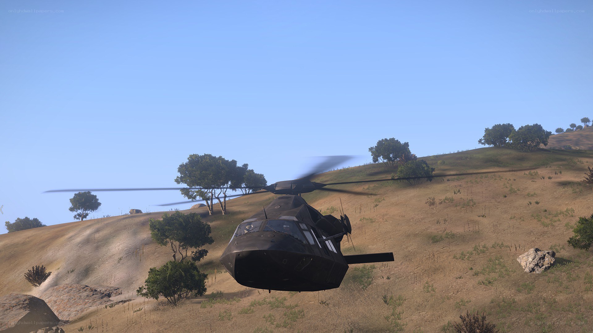 Helicopter flying over hills