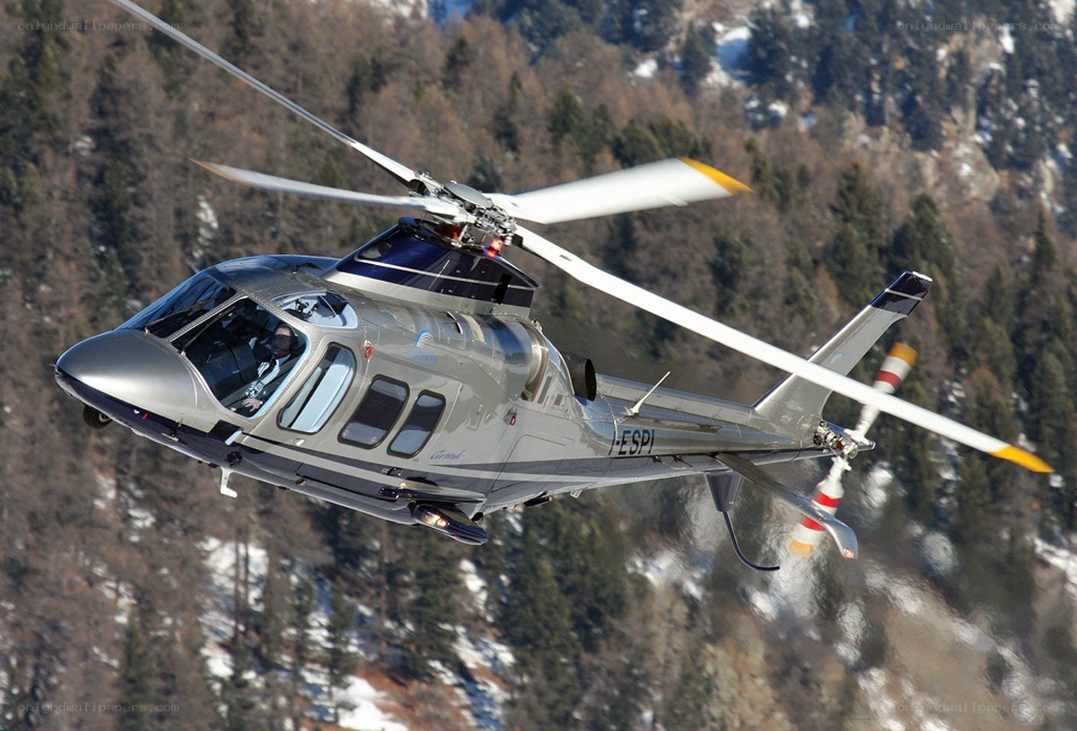 helicopter flying over mountains