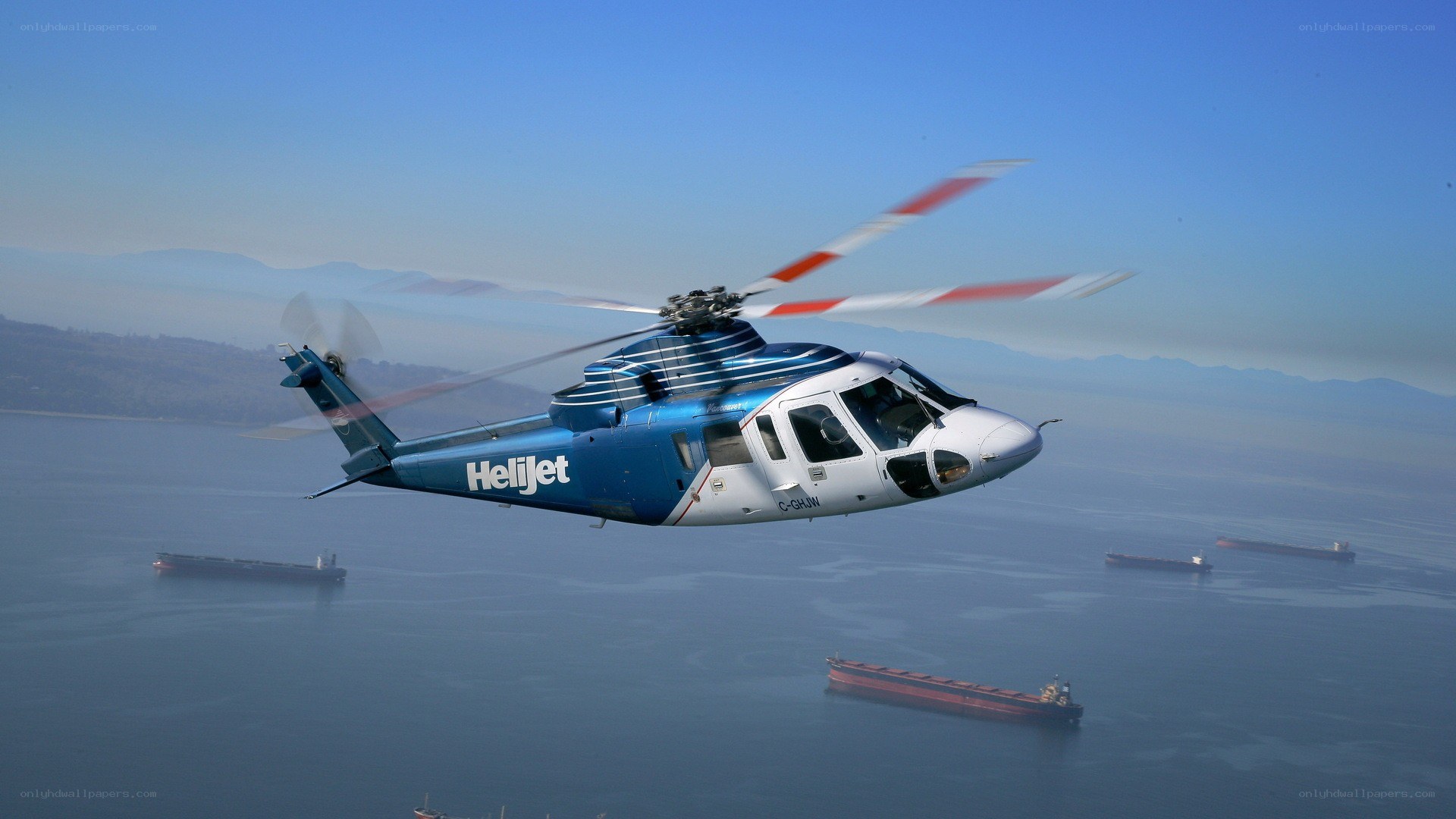 Helicopter flying over sea