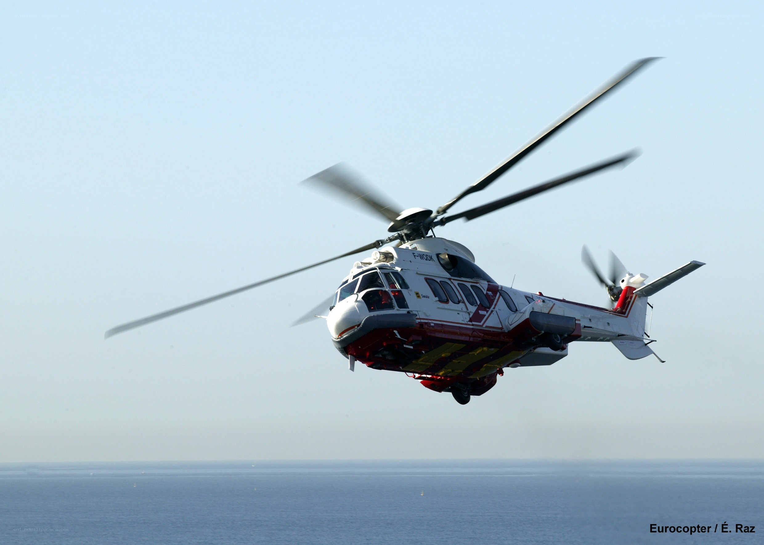 Helicopter flying over the sea