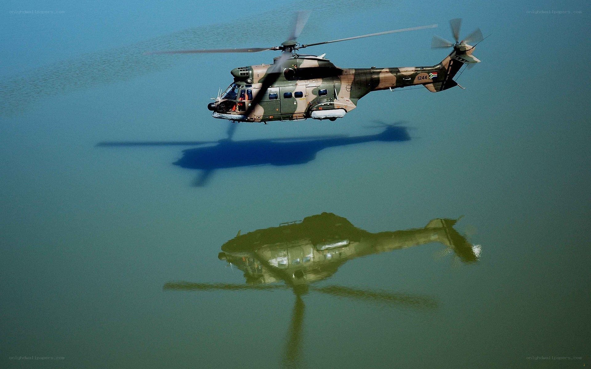 Helicopter flying over water