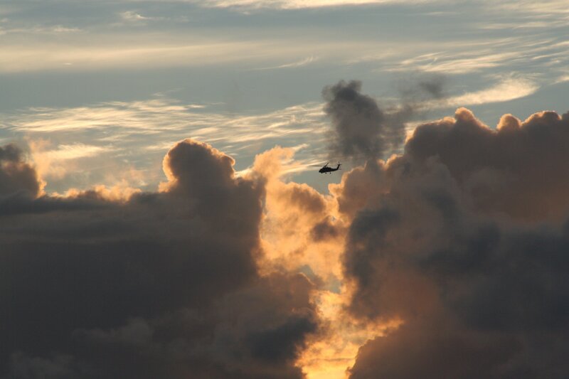 Helicopter flying through clouds