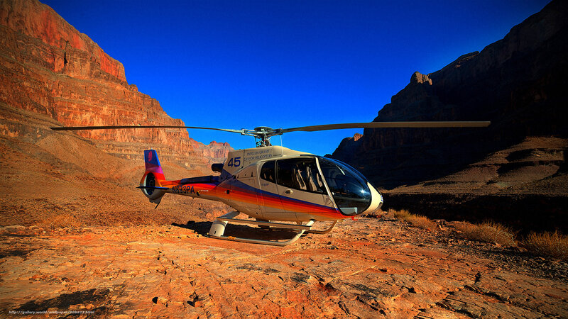 Helicopter in canyon landscape