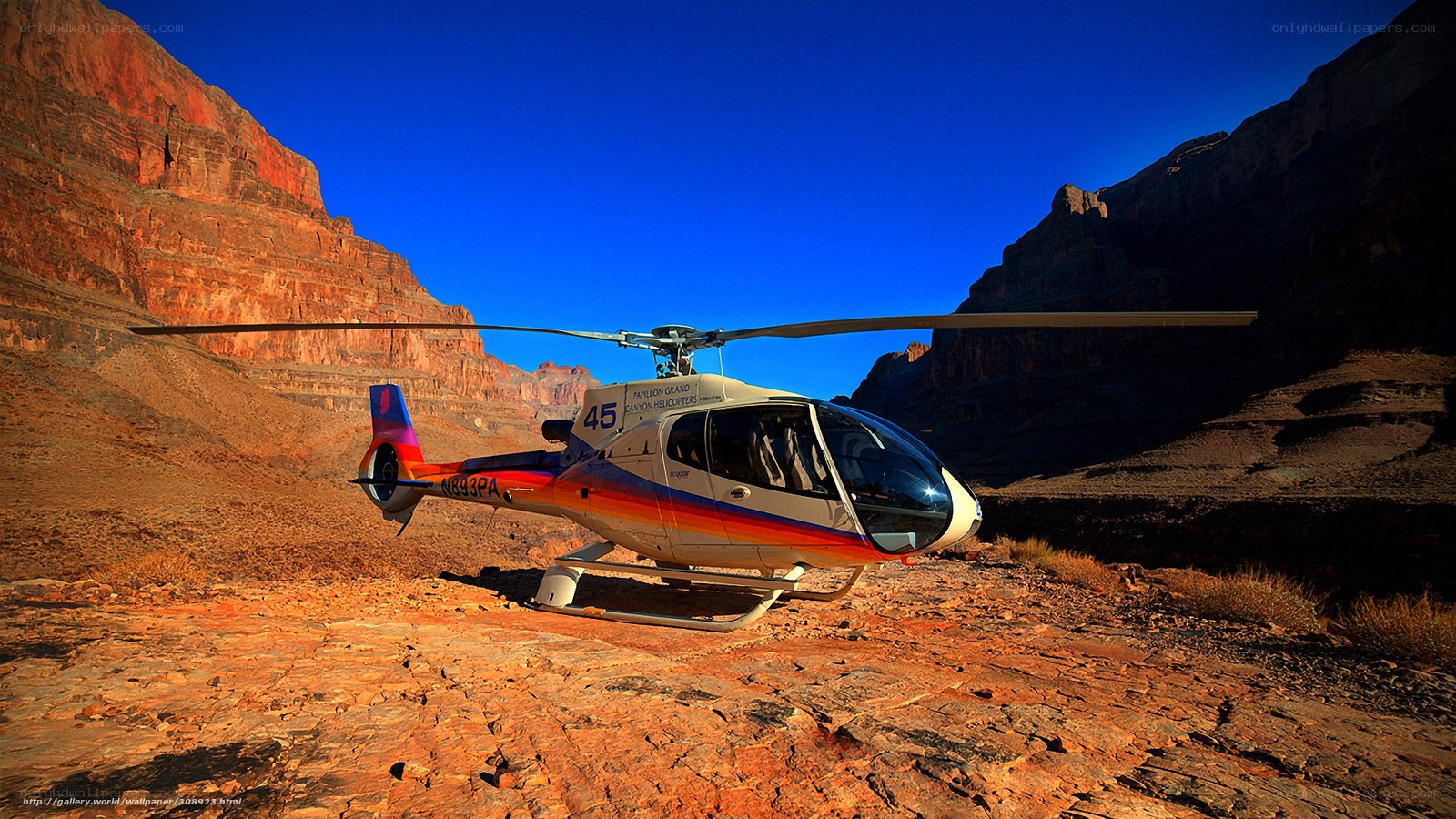 Helicopter in canyon landscape