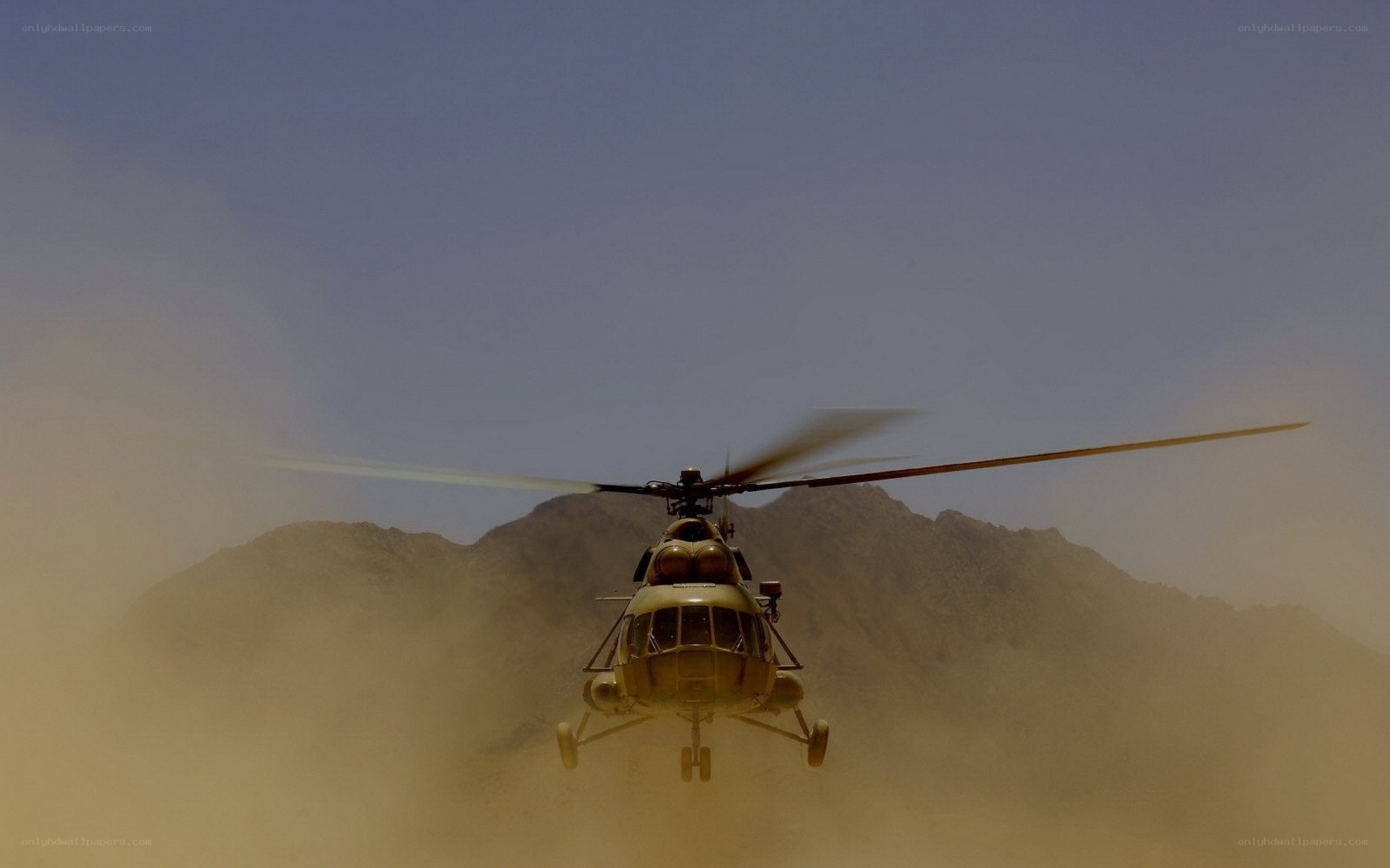 Helicopter in desert dust