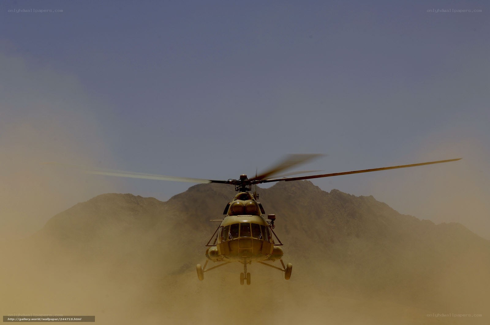 Helicopter in desert dust