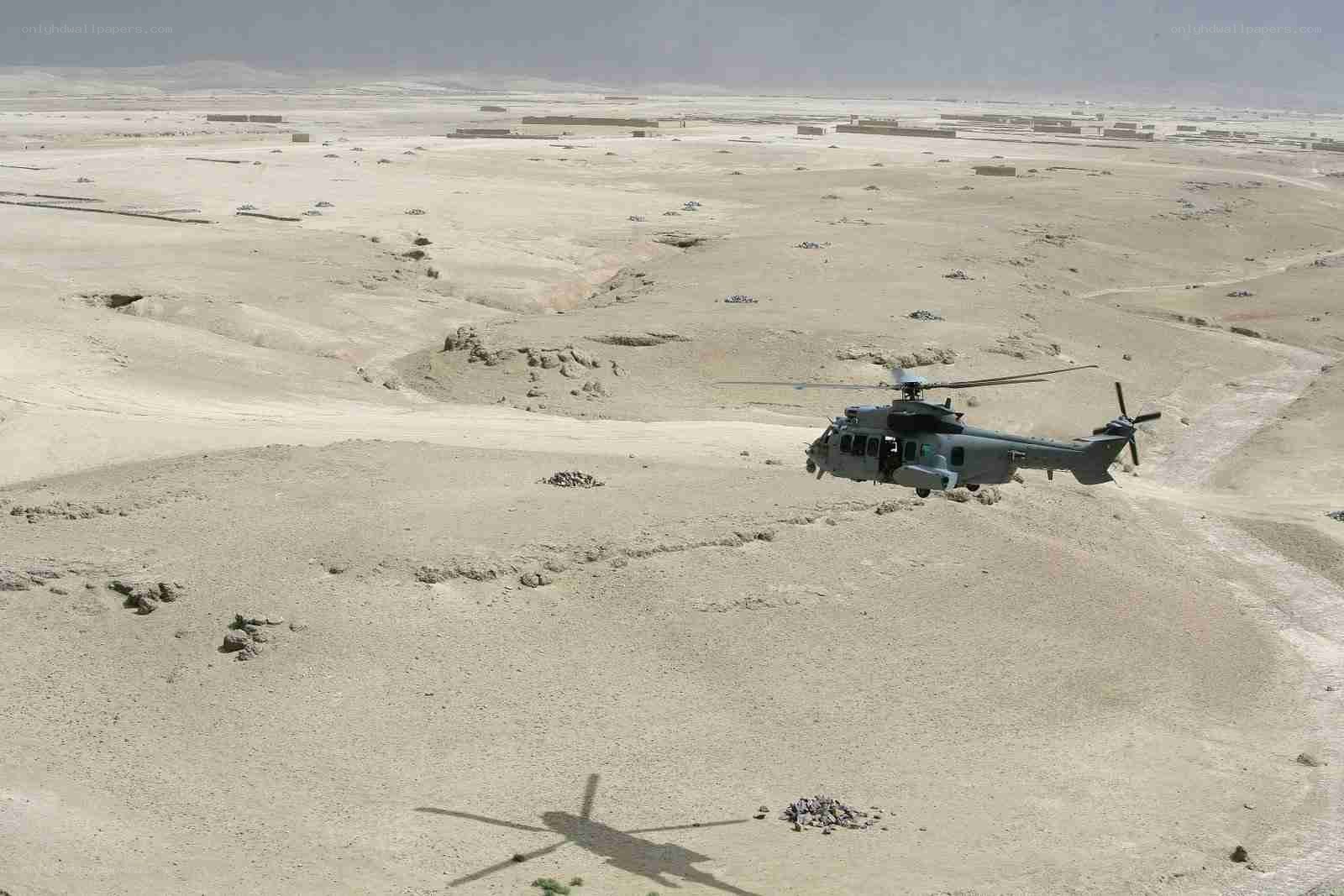 Helicopter in desert terrain