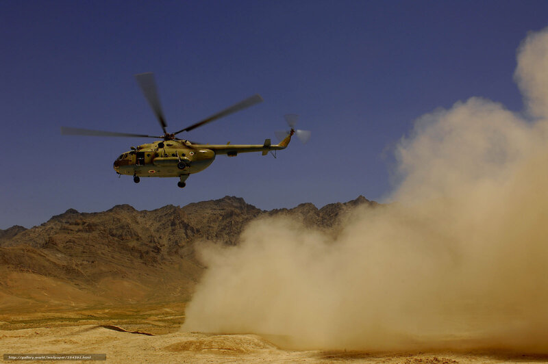 Helicopter in desert terrain