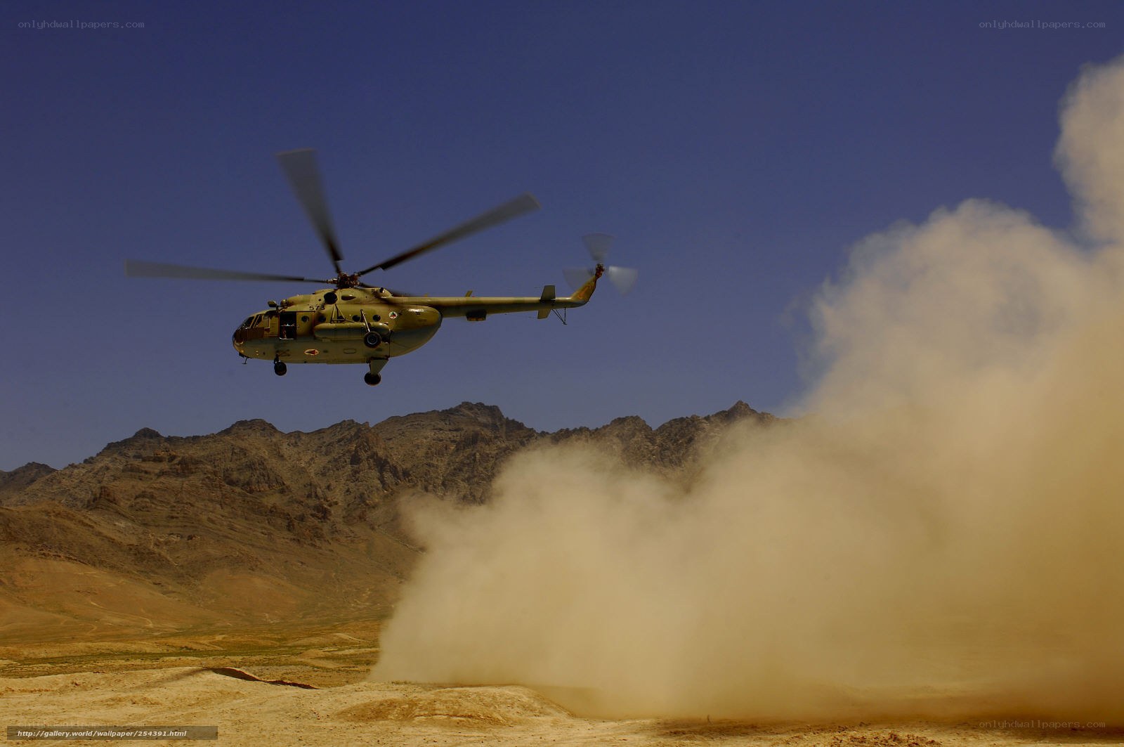 Helicopter in desert terrain