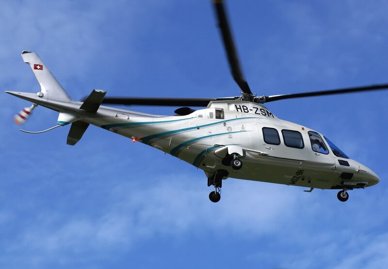 Helicopter in flight against blue sky