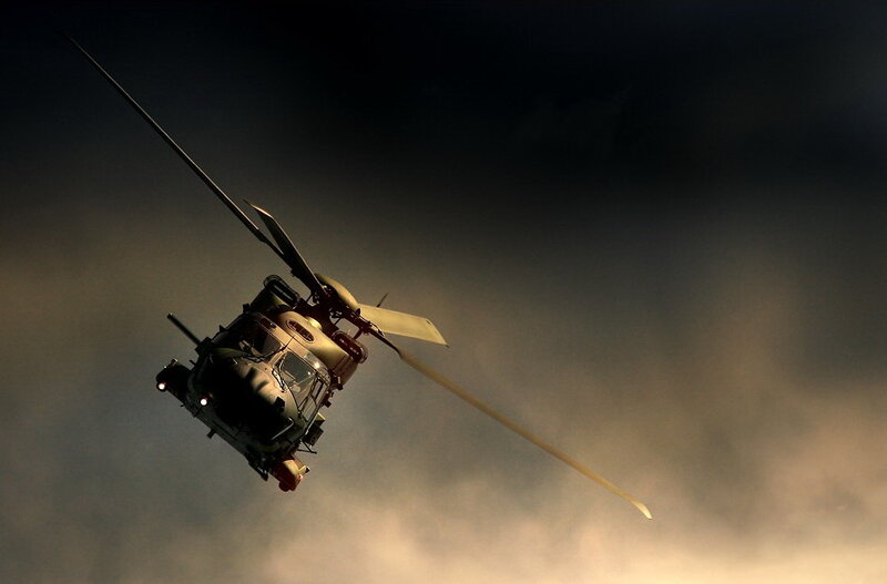 Helicopter in flight at dusk