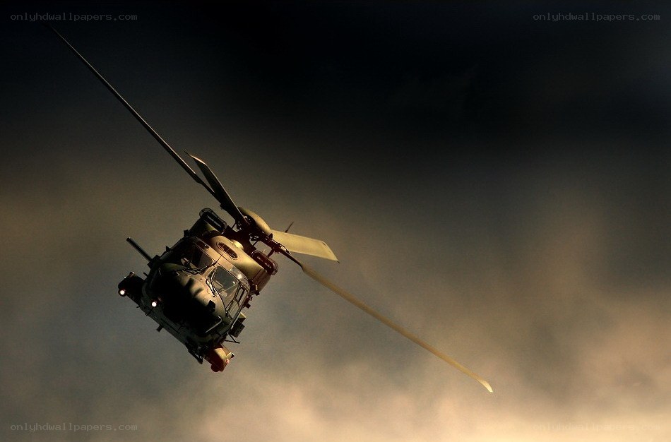 Helicopter in flight at dusk